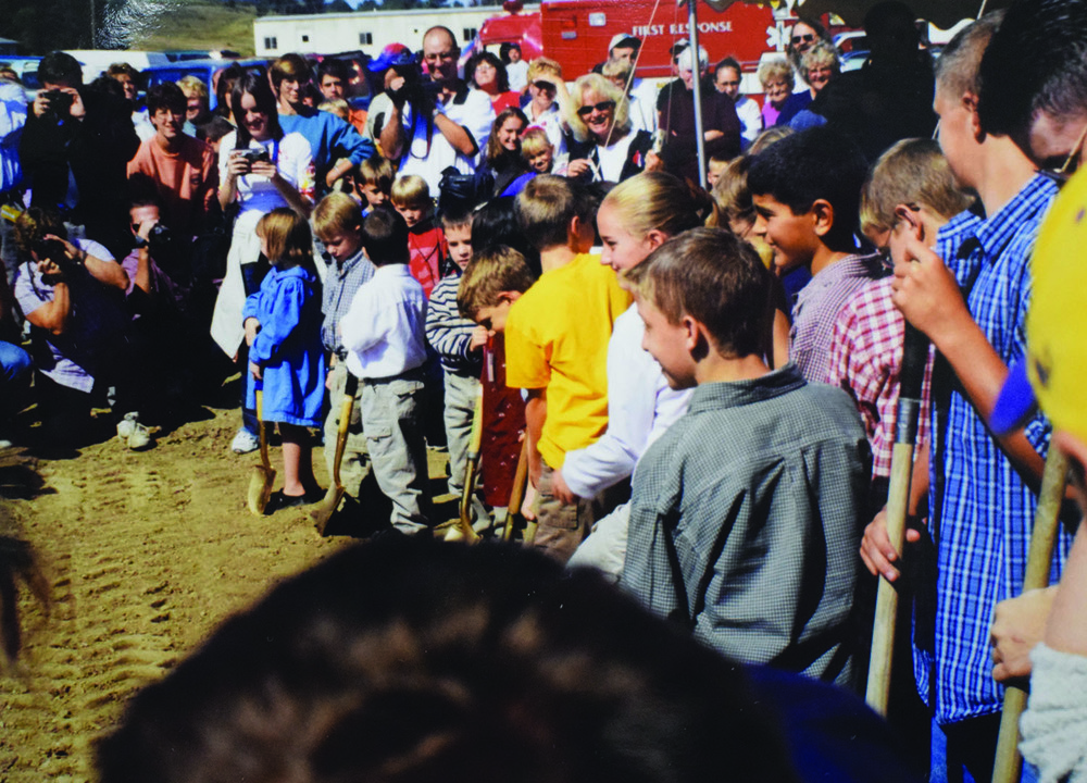 Students dig at a groundbreaking ceremony